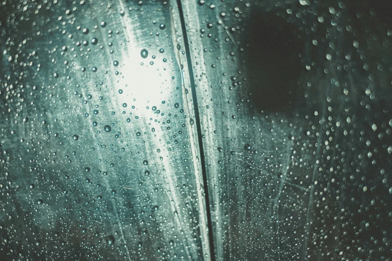 rain droplets falling from the top of a metal container