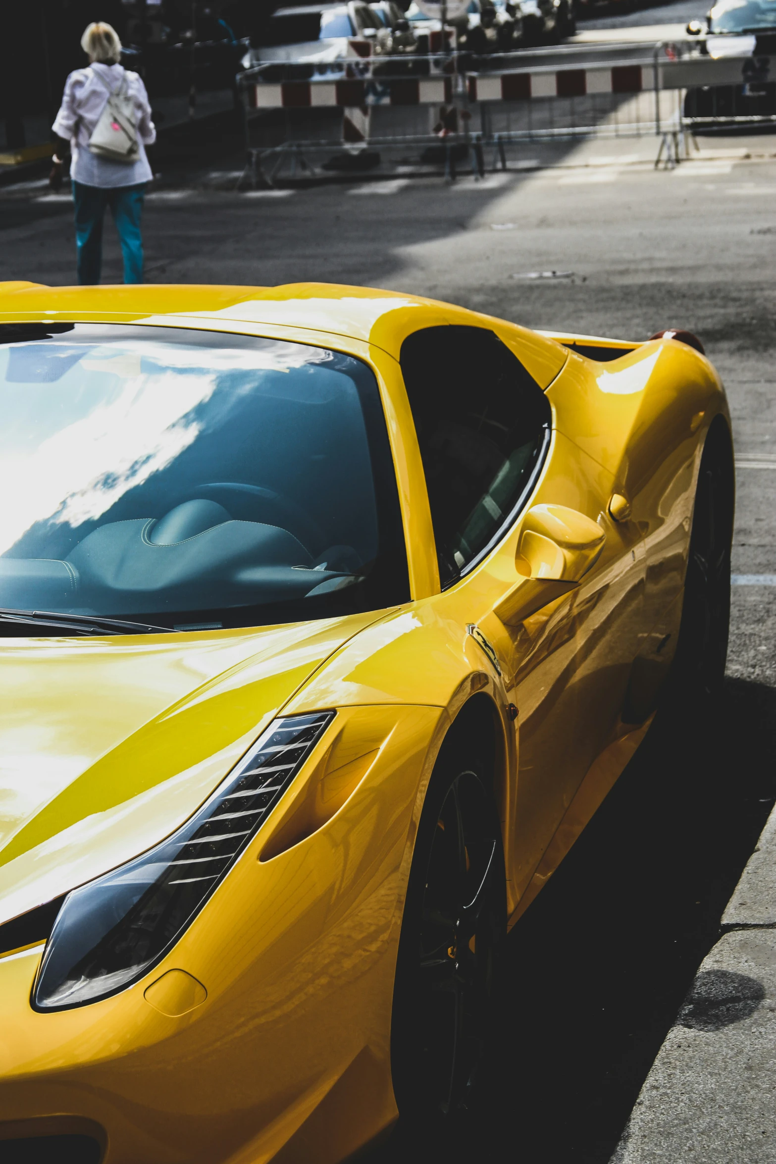 yellow sports car parked in an empty lot