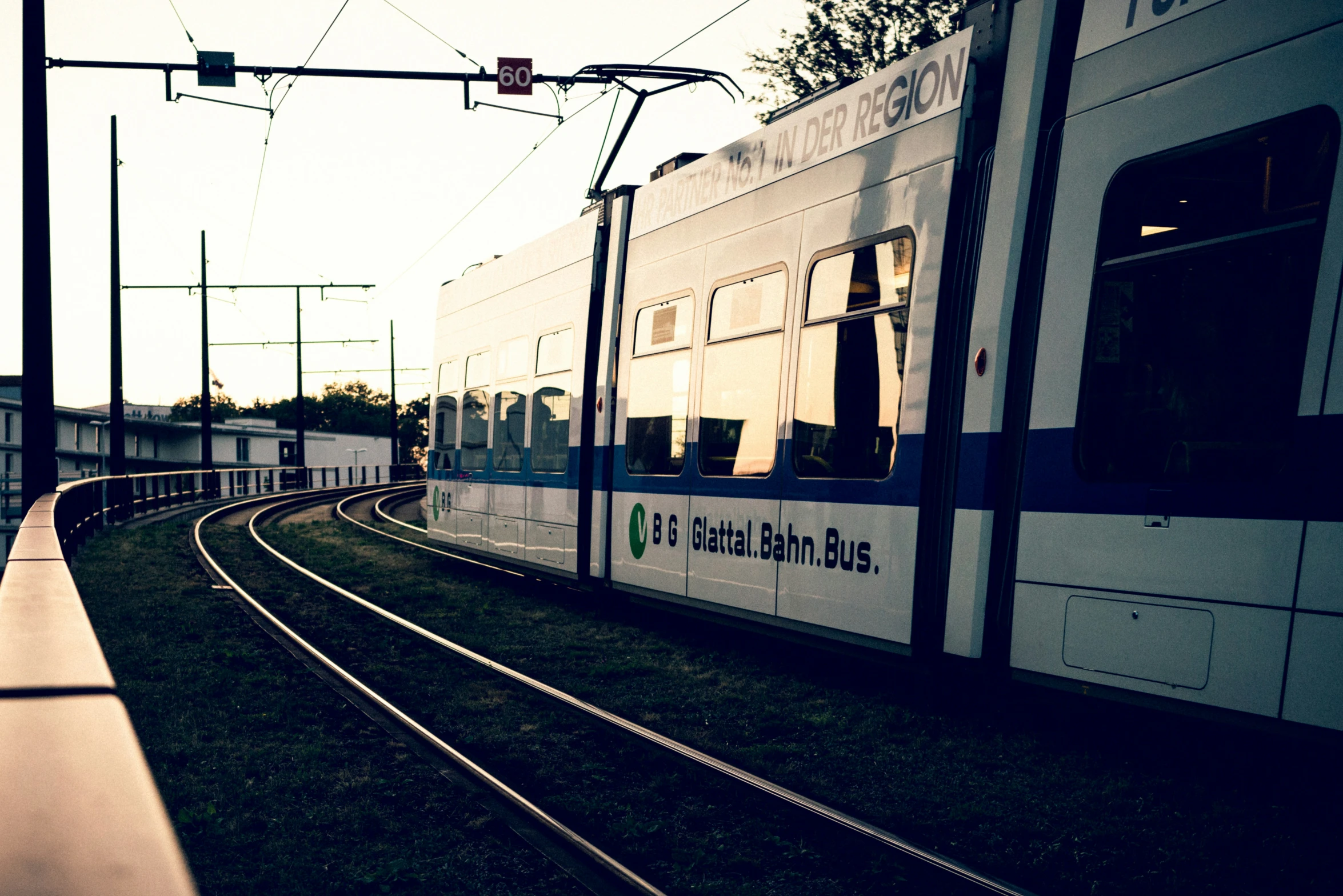 a train that is sitting next to a building