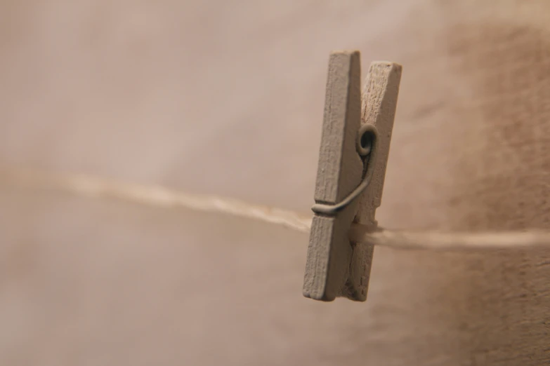 an angled view of a pair of scissors on a string