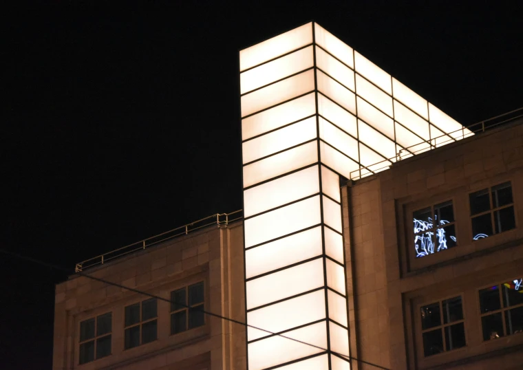 a tall clock tower sitting under a dark sky