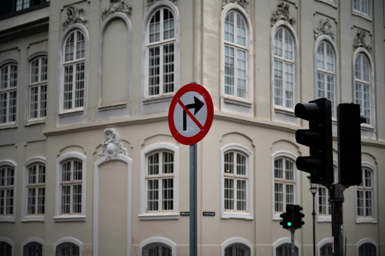 a stop and go sign with an arrow under the sign