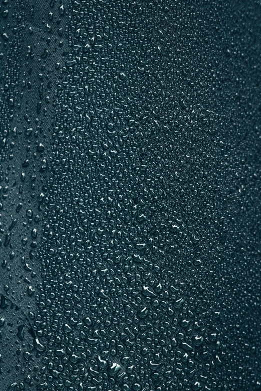 the ground is covered with raindrops in the dark