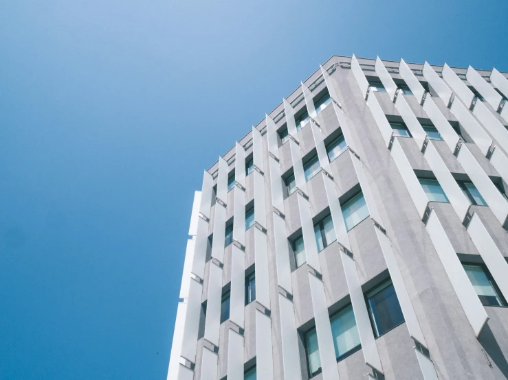 view looking up from the base of a high rise office building