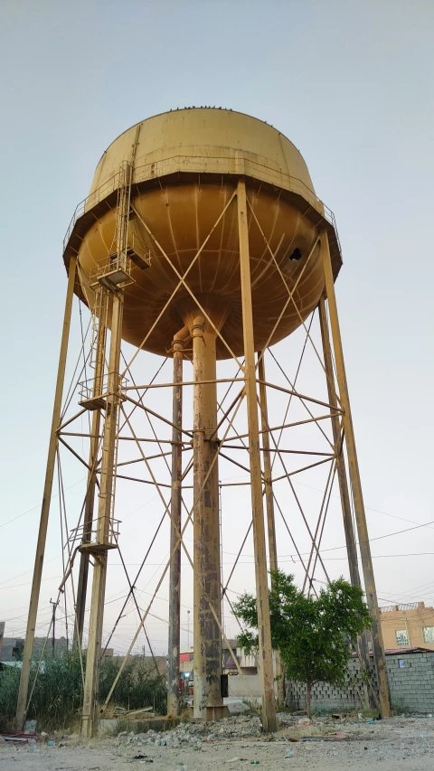 an old water tower with rusted metal construction