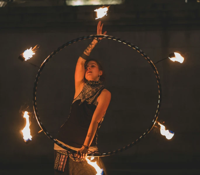 a girl that is holding some lights in her hand