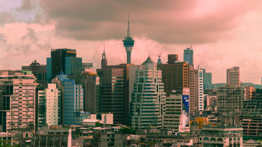 a view of buildings in the city from a hillside