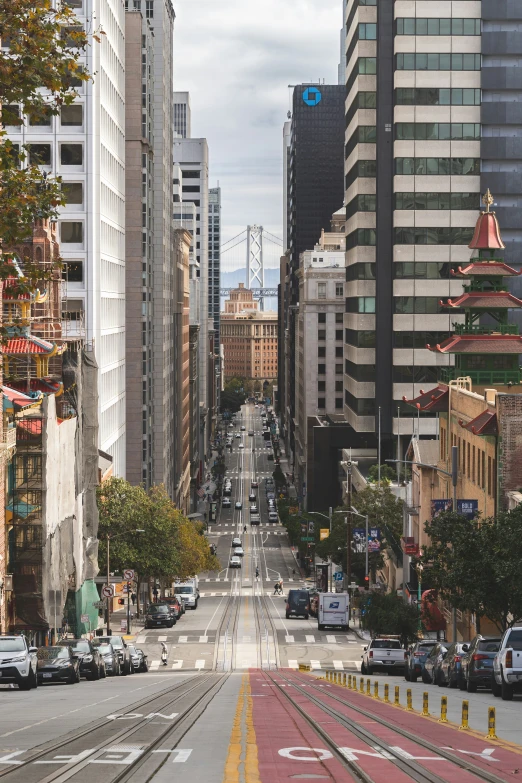 looking down a city street lined with buildings