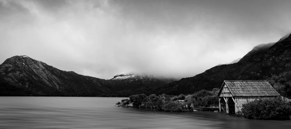 some mountains and water clouds and buildings