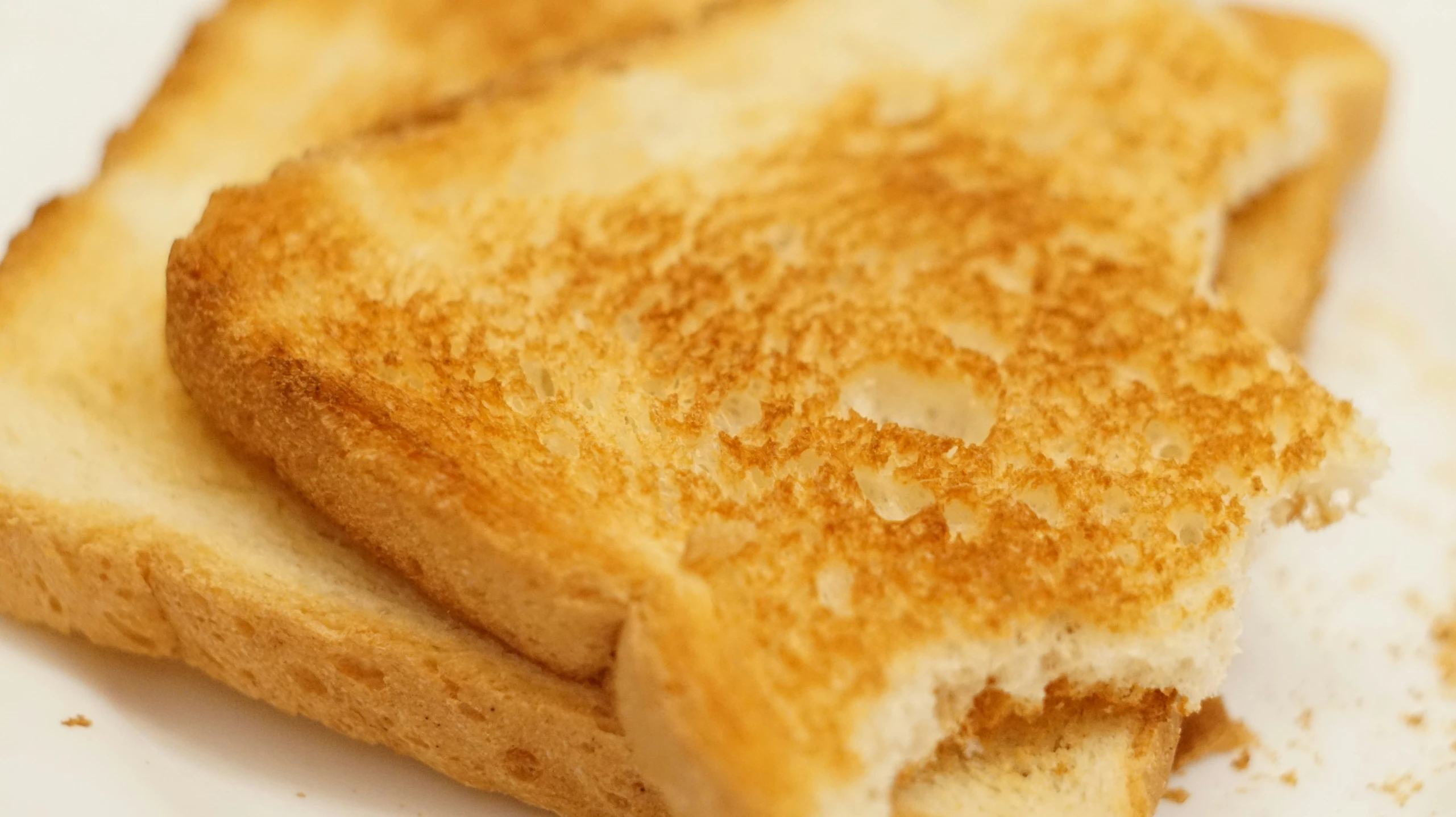 some toasted sandwiches are on a plate