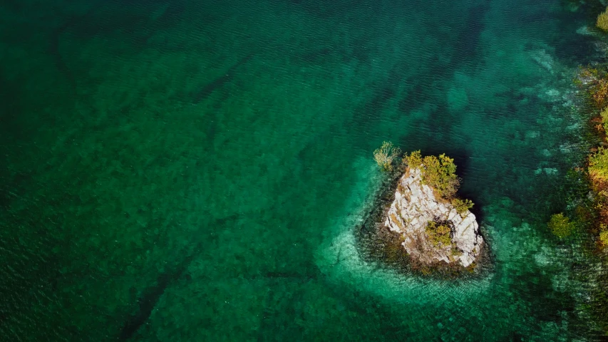 an aerial view of the beach and water