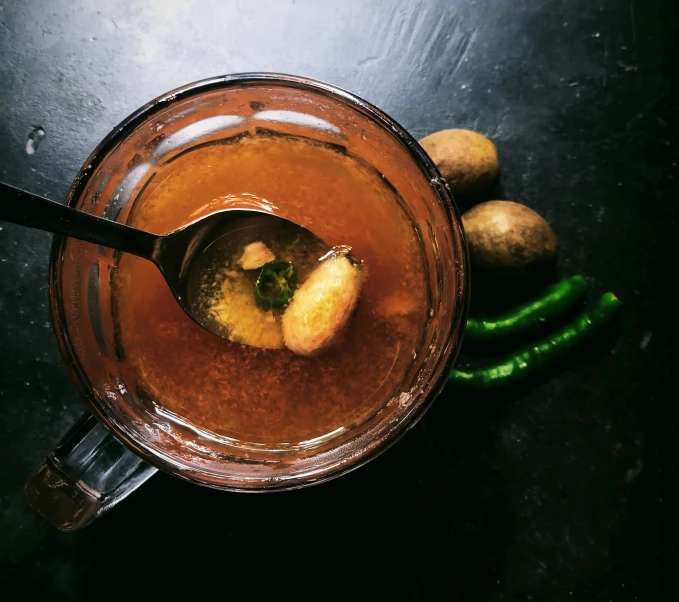 an image of an apple in a pot with food in it