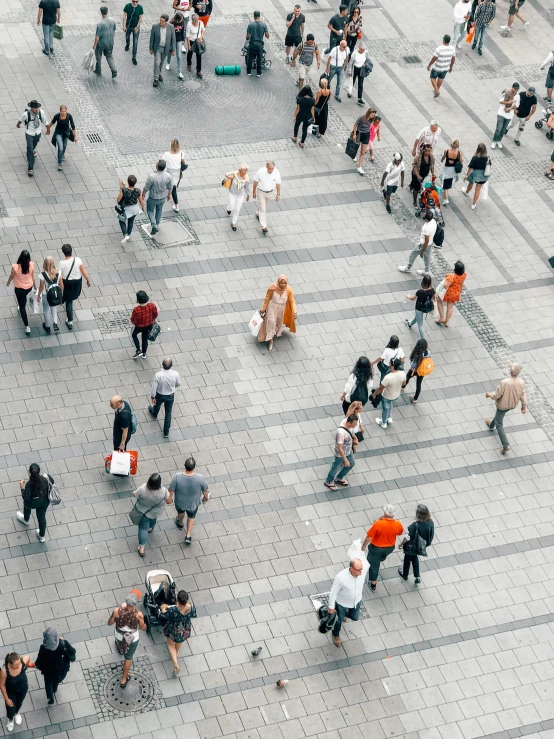 a group of people in square pavement area