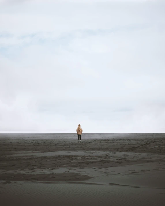 a woman is standing in the middle of a desert