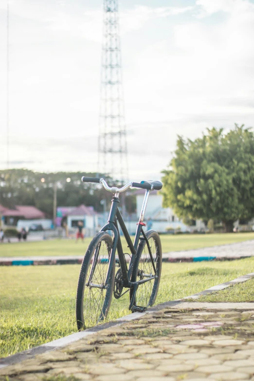 a bike parked on top of a green field