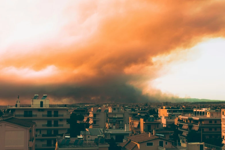 a large black storm moves through a city