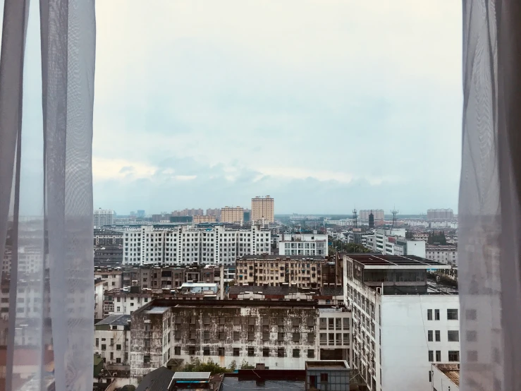 an aerial view of the city buildings from a el