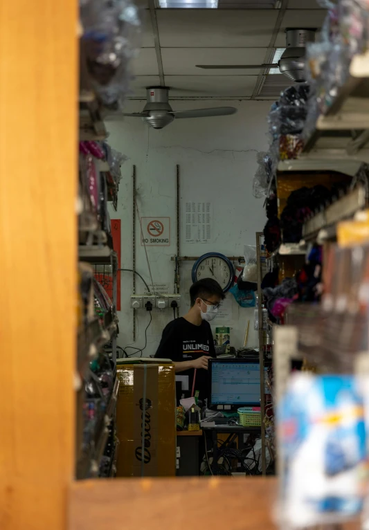 a person works on his computer in the store