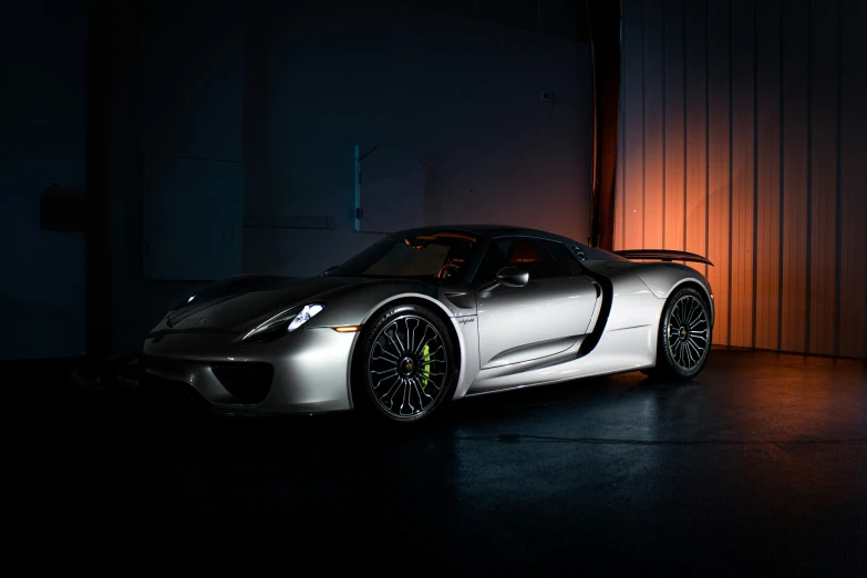 a car sitting in a dark room next to a door