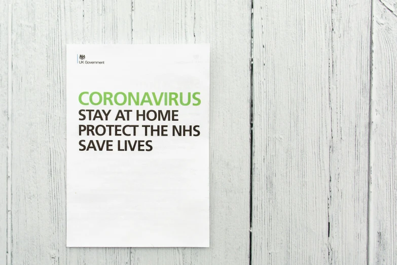 a paper napkin with a message stating coronavials stay at home protect the his save lives