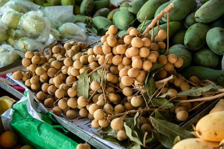 a bunch of fruits and vegetables that are being sold