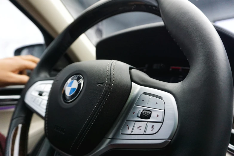 a car steering wheel and dashboard inside a vehicle