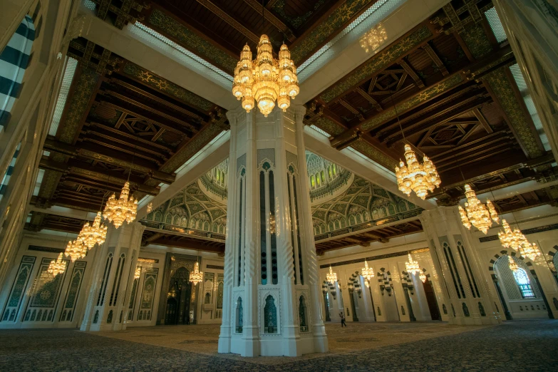 a large ornate room with several chandeliers hanging from the ceiling