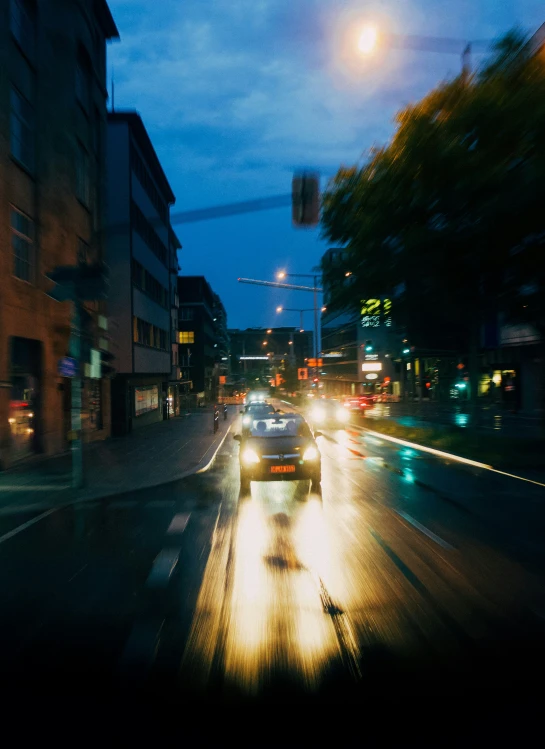 a blurry image of a city street with cars