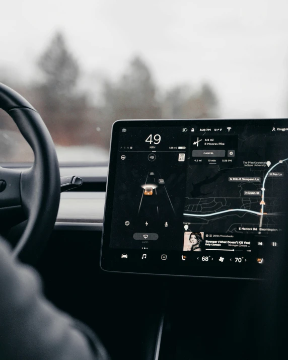 the computer screen of a car showing road trip data