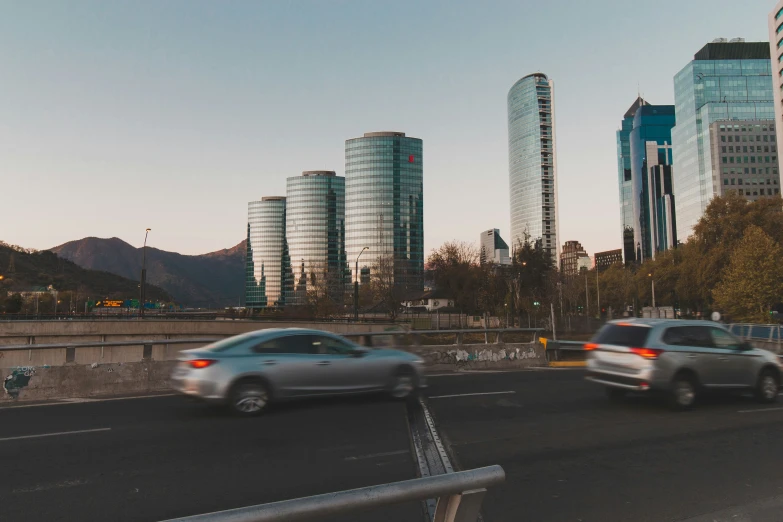 cars are travelling in an intersection on the highway