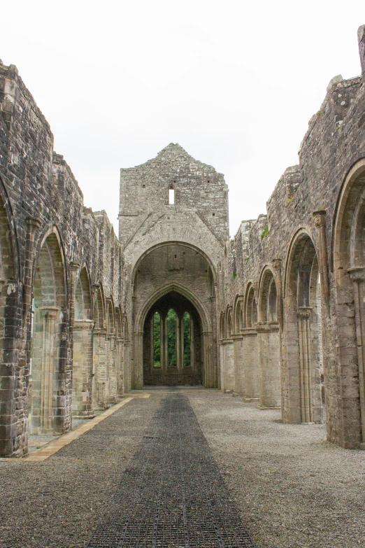 stone buildings with arches on one side and stone doorways on the other