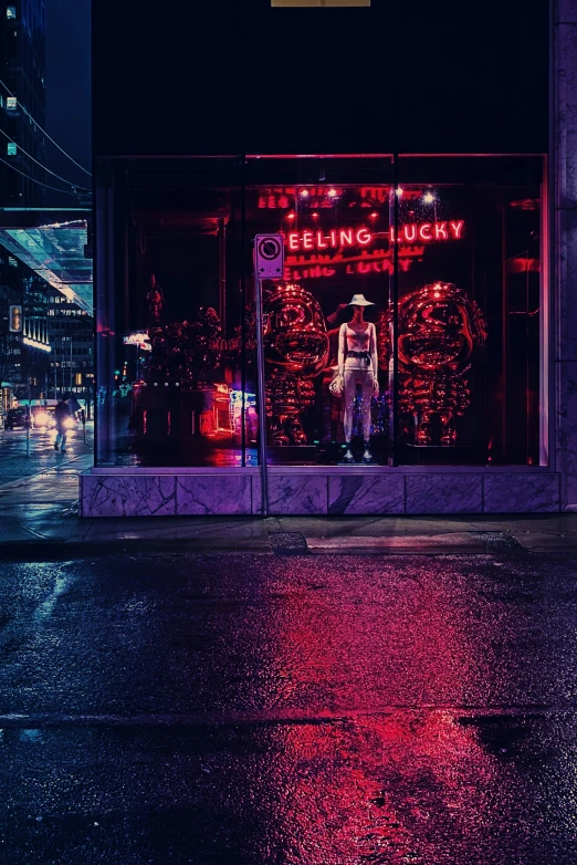 a store front on a street with neon lights