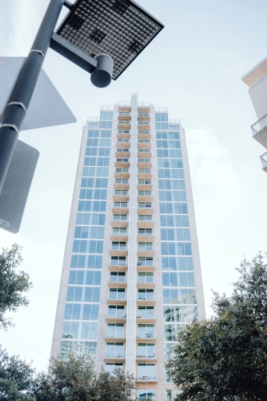 an image of a high rise building taken looking up