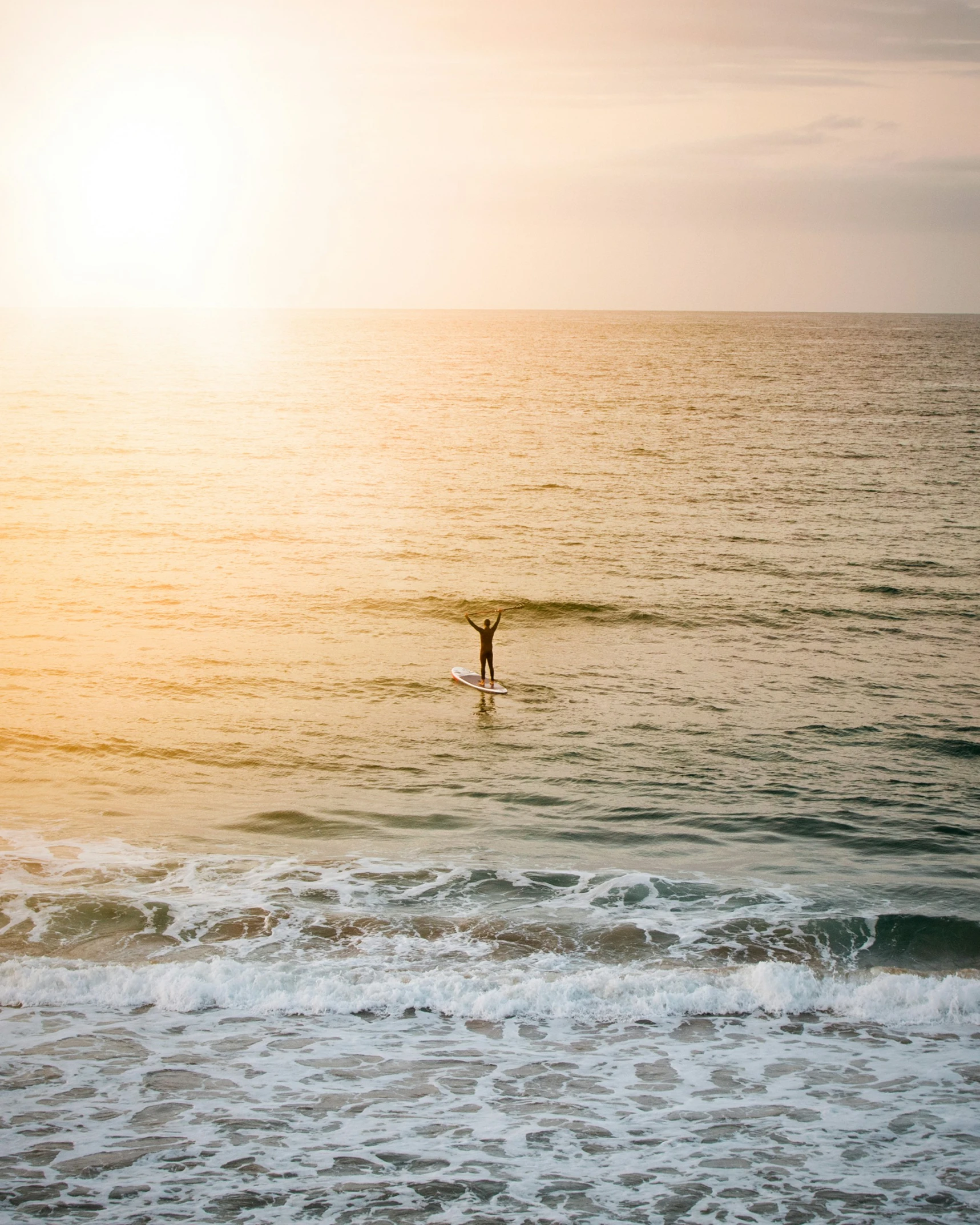 a person riding their surfboard on top of a wave