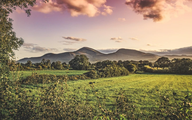 a mountain range is seen from a distance in a scenic area