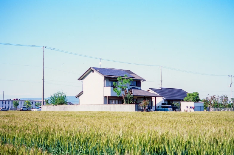 a house is in the middle of a field