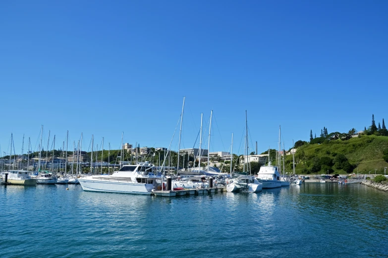 several boats are in the water near one another