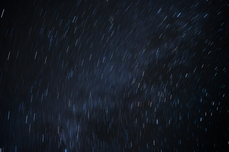 night sky with stars and the moon behind them