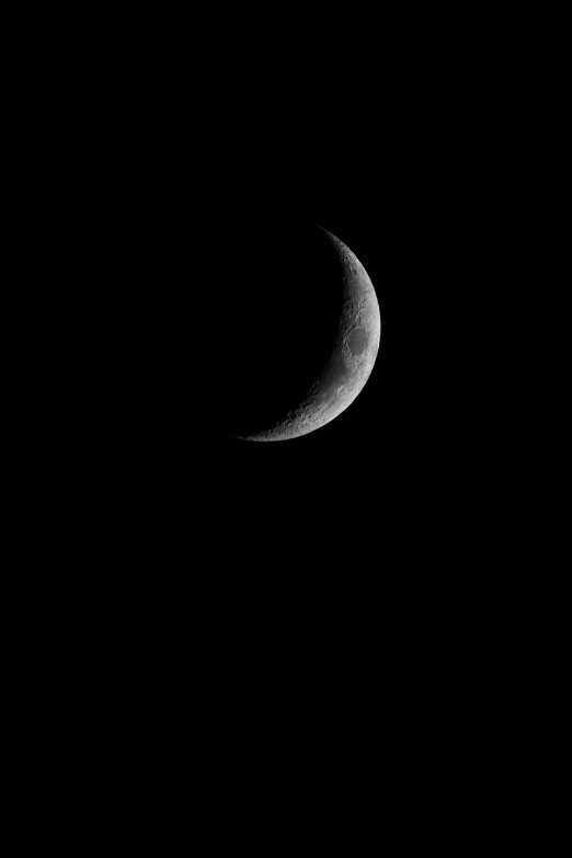 the moon as seen through a telescope lens