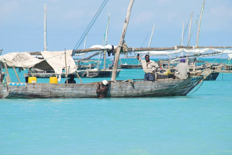 a boat with people on it in the water