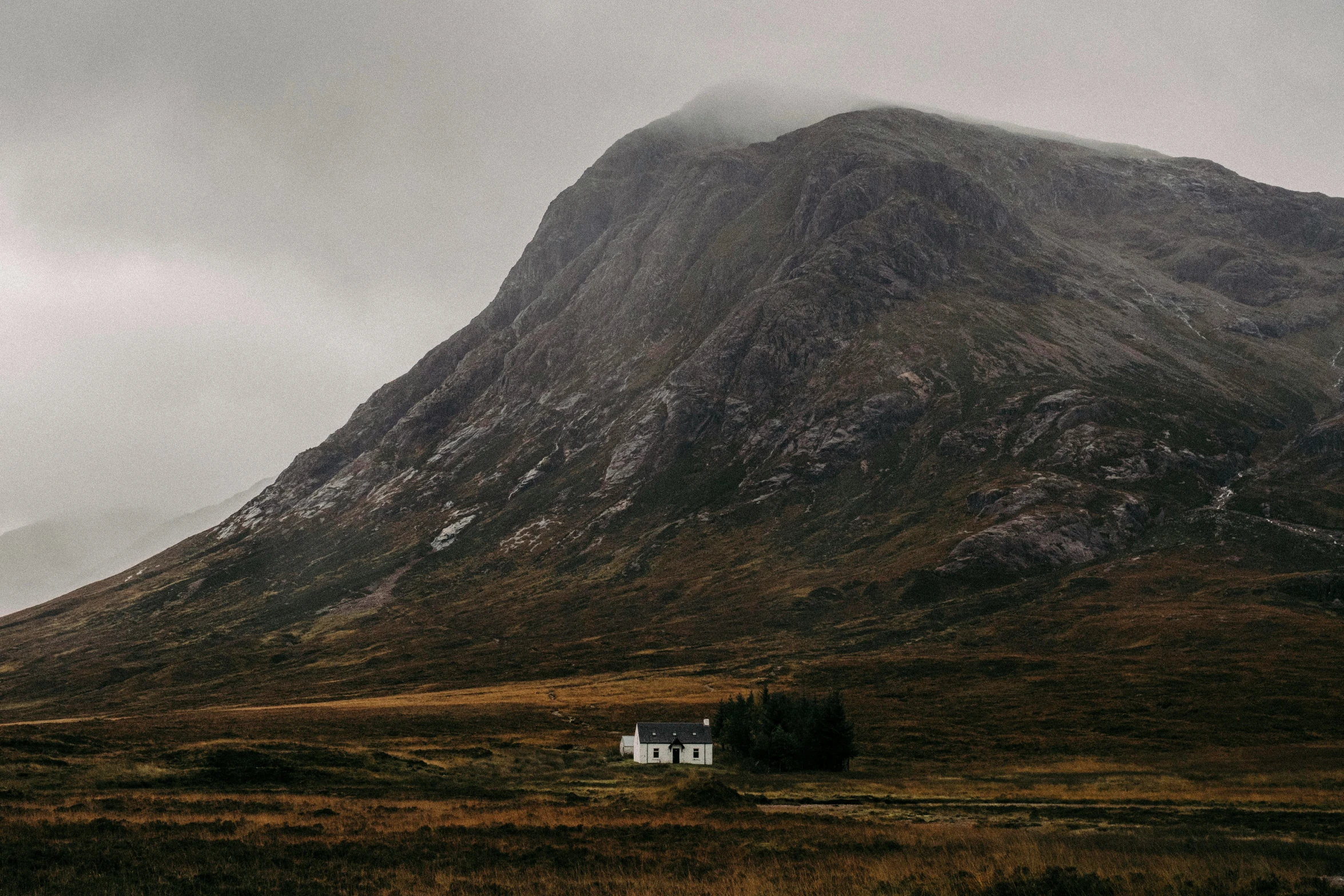 a house that is near some big mountains