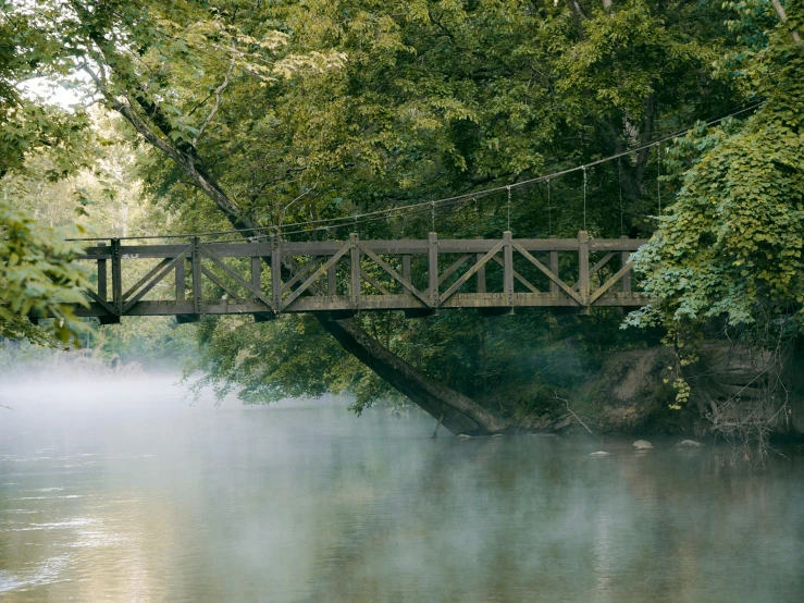 the bridge is suspended above the water