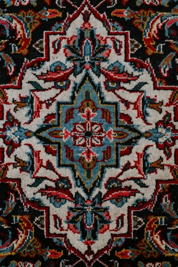 a colorful multi colored rug with intricate ornaments