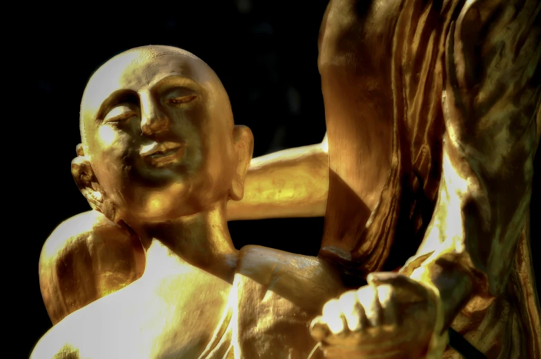 an abstract po of some gold colored statues