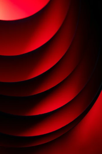 a red wall with curves that appear to be curved