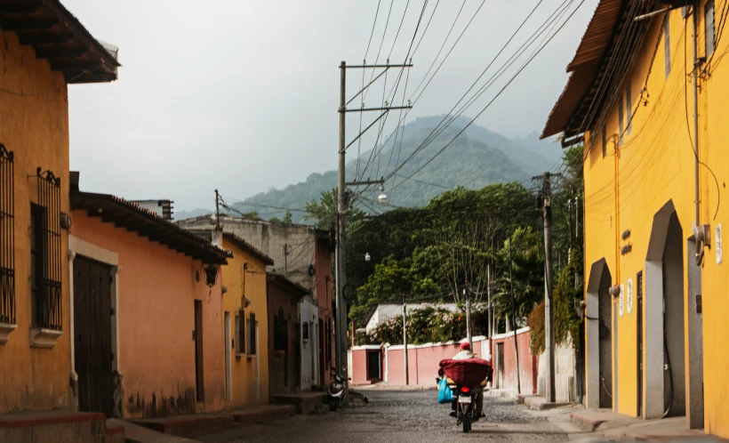 a person on a bicycle in the middle of a street