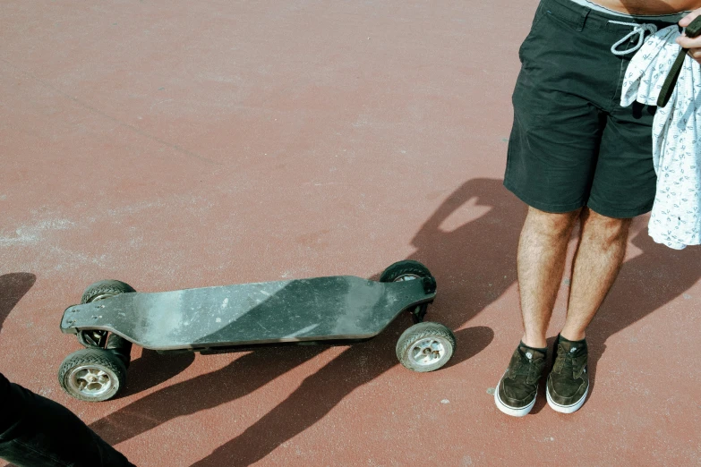 two people with one on one board and one on another