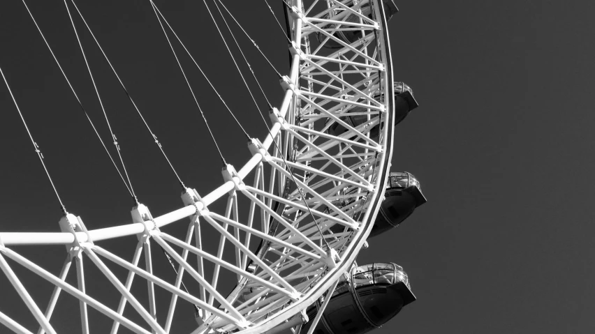 a black and white image of an observation wheel