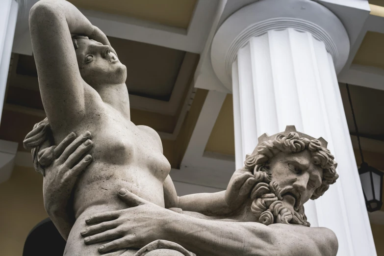 a statue of a man and a woman holding each other