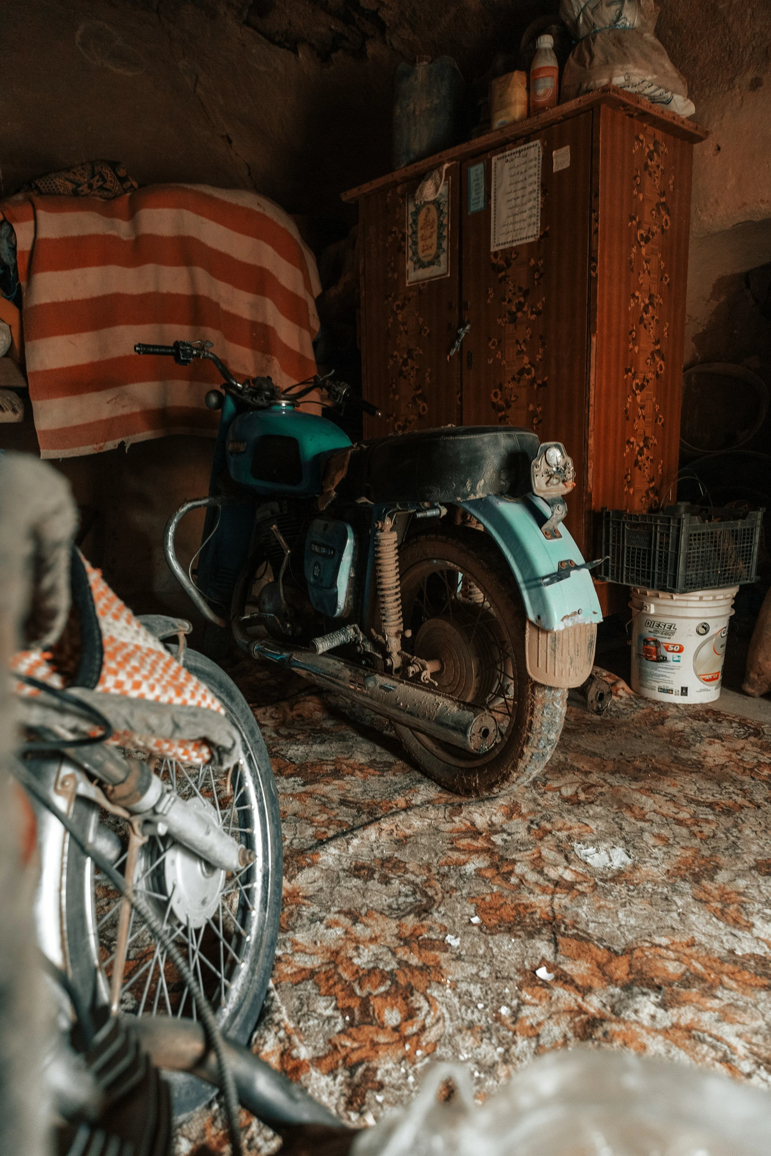 a motorbike sits on top of a tiled floor